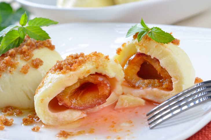 Yeast dumplings with whole plums
