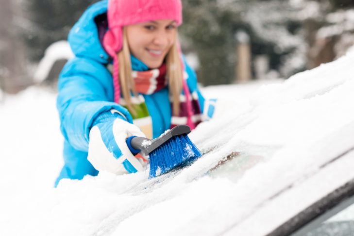 A hand brush helps to clean the windows.