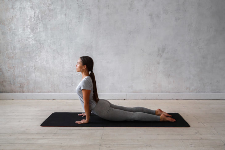 The cobra strengthens and relaxes the back while simultaneously stretching the stomach, lungs, shoulders, chest and spinal column.