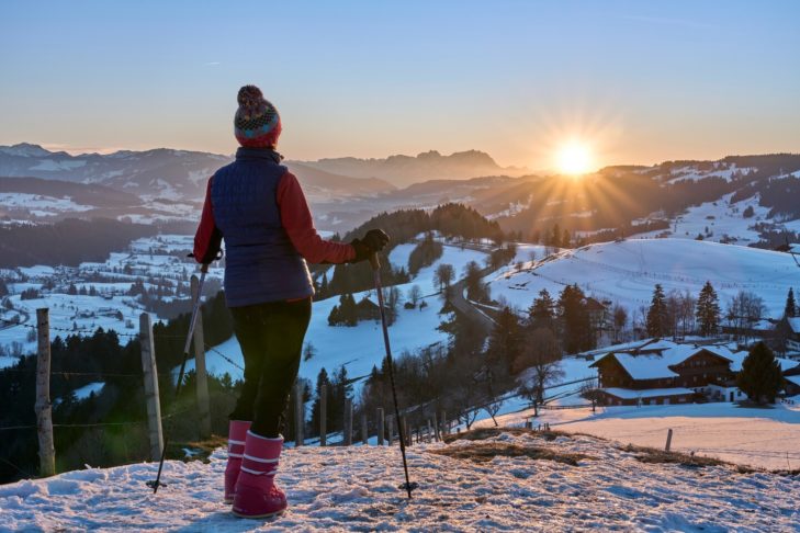 Winter hiking at sunset in the Vorarlberg forest