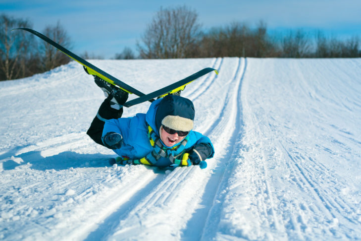 A boy has fun cross-country skiing.