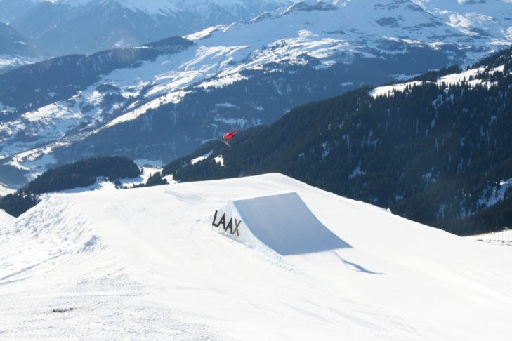 Laax in Switzerland is one of the ski resorts that is extremely popular with snowboarders due to its spectacular snow parks with slopestyle courses and halfpipes