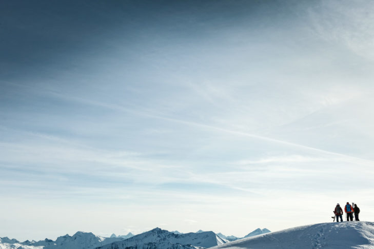 At the summit, the group and guide are completely on their own when heliskiing.