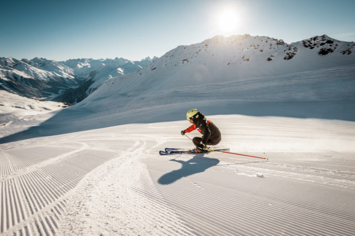 A whopping 211 kilometres of pistes await skiers and snowboarders in the Davos Klosters Mountains ski area in winter
