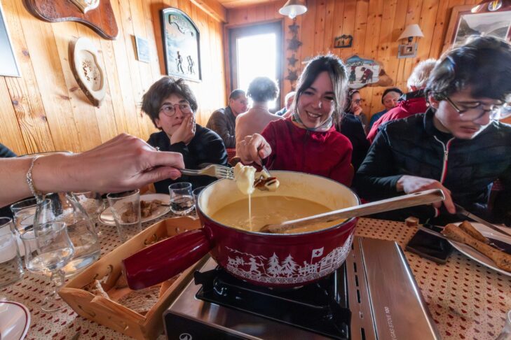 Fondue Savoyarde, where chunks of bread are dipped into melted cheese and white wine, is one of the culinary highlights in the French Alps.
